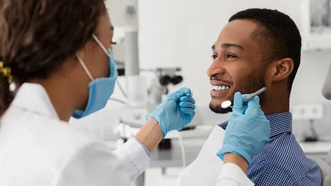 Dentist with patient